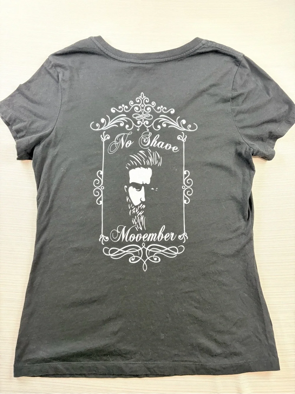District Black Tee with White 'No Shave Movember' Graphic